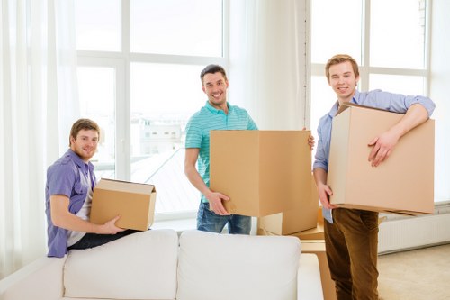 Movers unloading household furniture at a Chalkfarm property