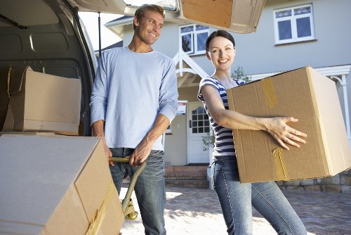 Professional movers loading items into a van in Chalkfarm